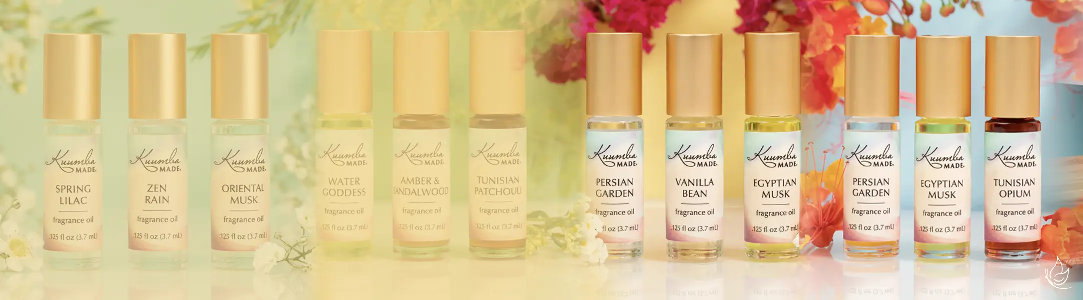 Kuumba Made Fragrances and products in a photo with flowers